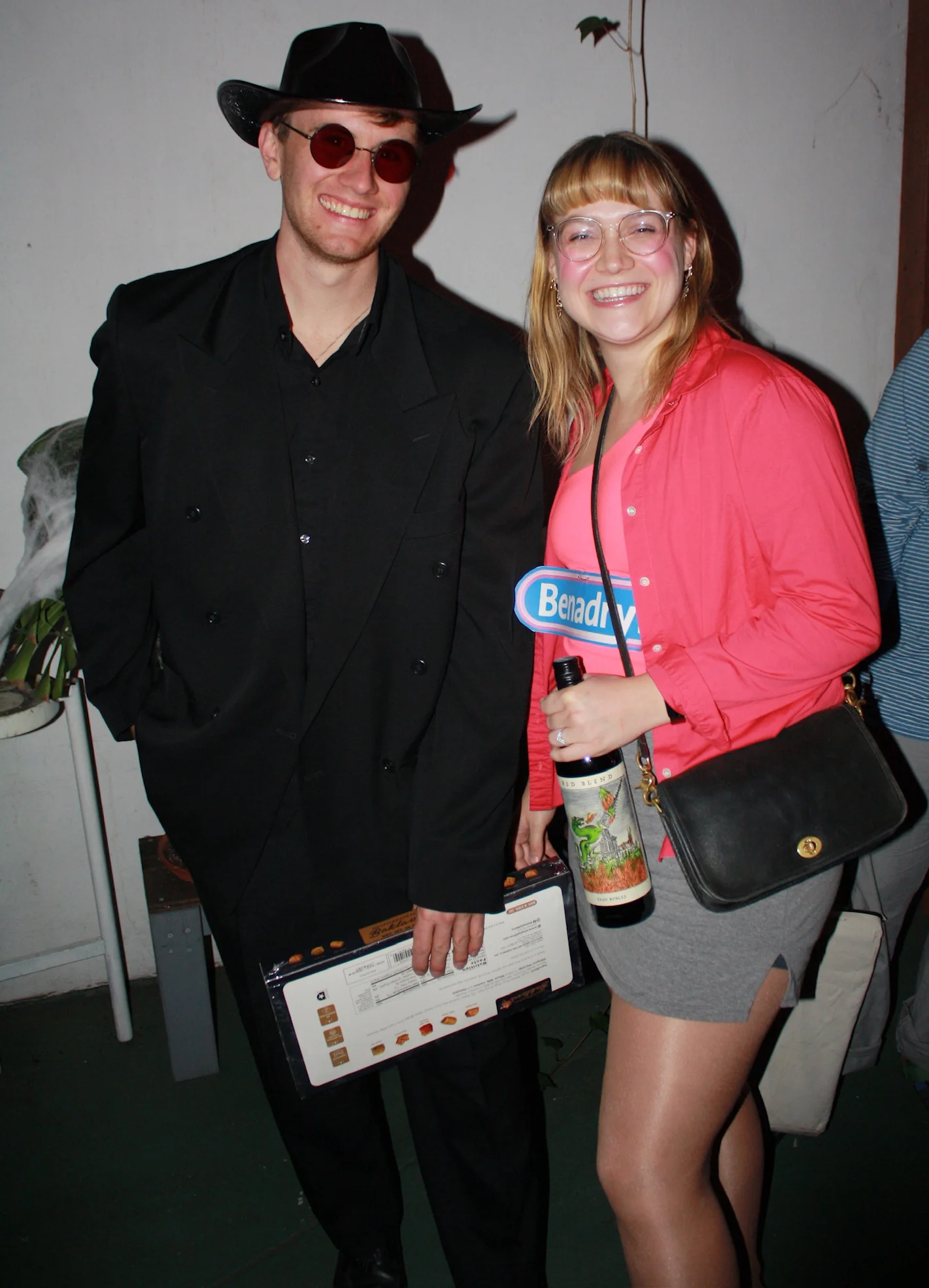 Two friends showing their Halloween costumes